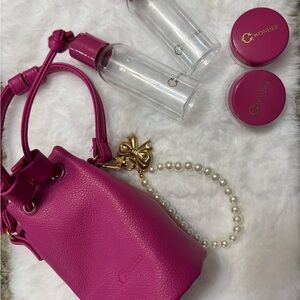 C. Wonder Pink Mini Bag with Gold Bow Accent